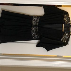 Black dress. Above the knee/mini